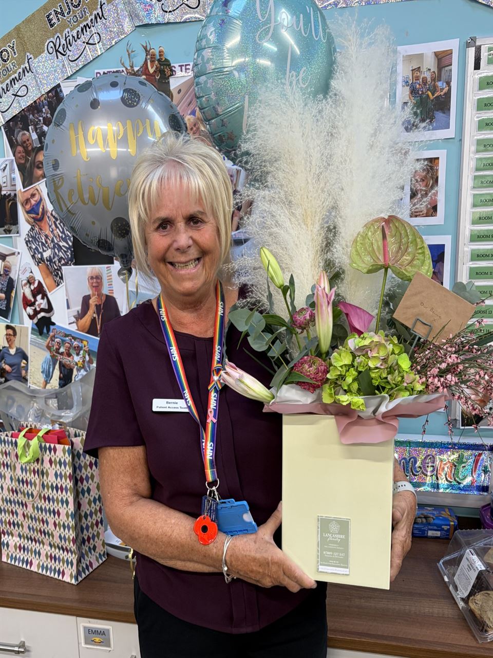 picture of Bernie holding a box of flowers